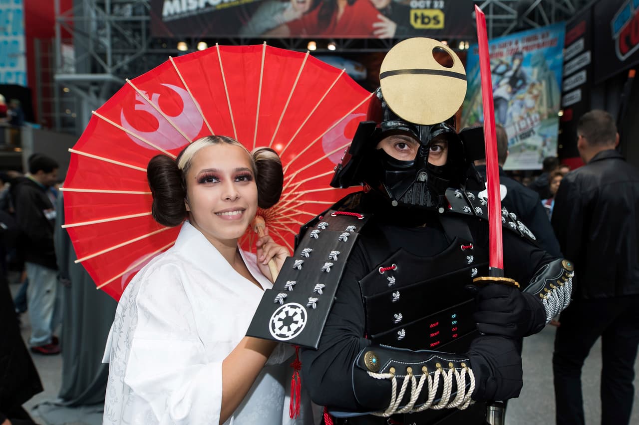 Attendees dressed as Japanese Princess Leia and samurai Darth Vader pose during New York Comic Con at the Jacob K. Javits Convention Center on Sunday, Oct. 6, 2019, in New York. (Photo by Charles Sykes/Invision/AP)