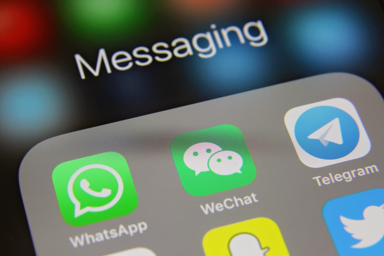 London, UK - 02 06 2016: Apple iPhone 6s screen with online messaging application with other social media icons WhatsApp, Telegram, WeChat, Skype, Twitter, Snapchat etc.