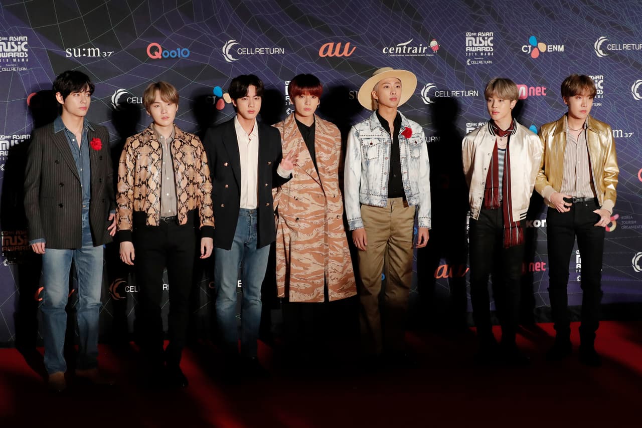 Members of the band BTS pose for photographers upon arrival at the Asian Music Awards in Nagoya, Japan Wednesday, Dec. 4, 2019. (AP Photo/Lee Jin-man)