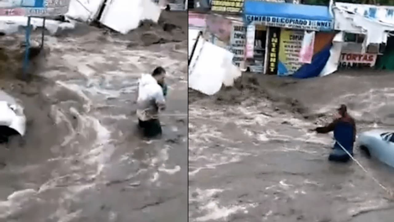 Vecinos de Ecatepec rescatan a bebé de un coche durante la inundación