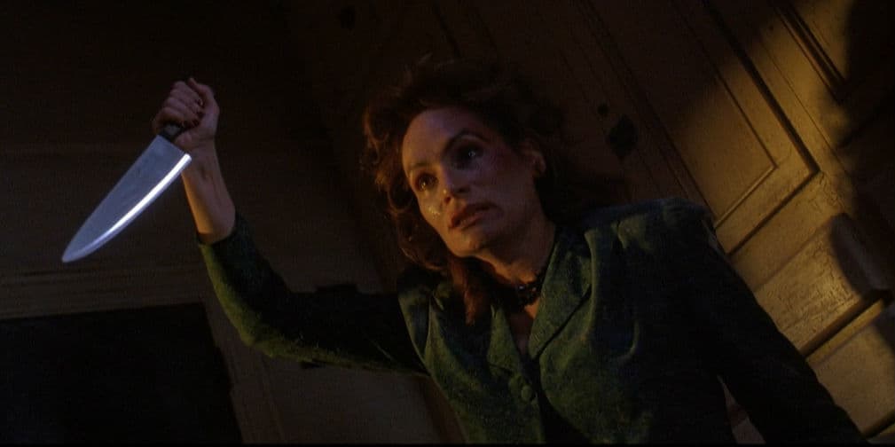8. Mommy: Una mamá siniestra interpretada por Wendie Robie en The People Under the Stairs (1991). ¡No te metas con ella!